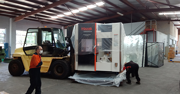 Mazak VARIAXIS C-600 being unloaded and unwrapped